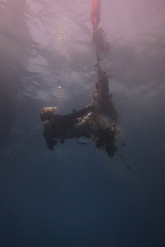 James floats the large nets sent up from the depths by SMB back to the boat