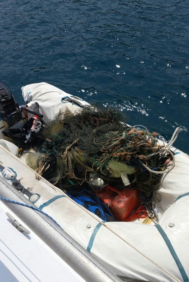 A dinghy full of debris