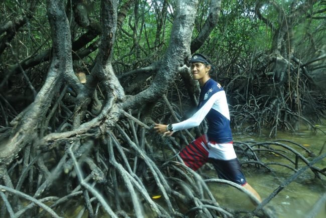 Emir contemplating the effects of all this rope strangling the mangrove roots
